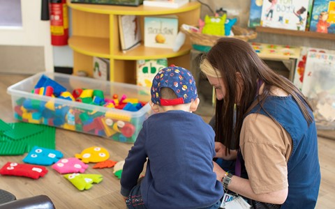 Helping Hands Nursery Staff with Child