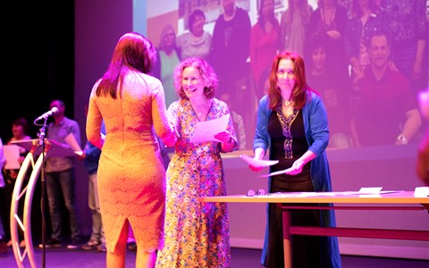 Student being presented with a certificate