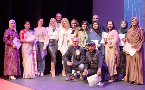 Group of students posing with certificates