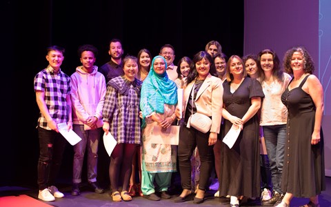 Group of students posing with certificates