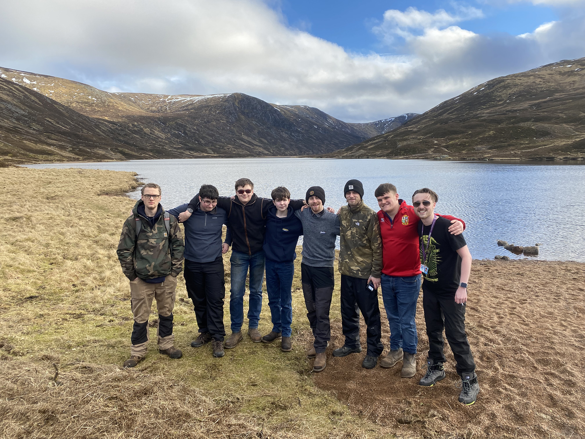 Group photo of students on Learner Engagement Team trip at loch.