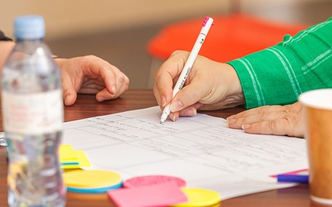 Person working on service design activity