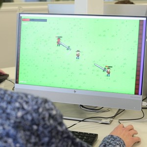 Student playing game on computer