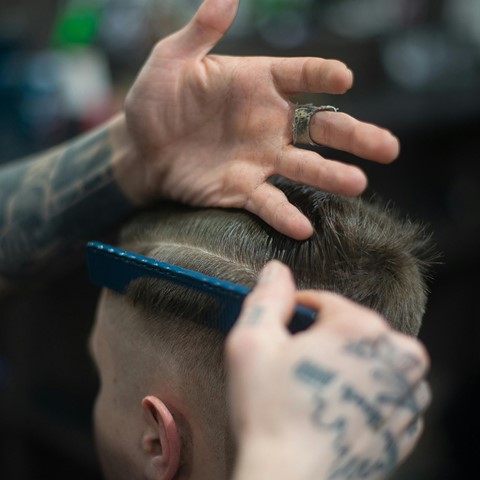Barber cutting someone's hair