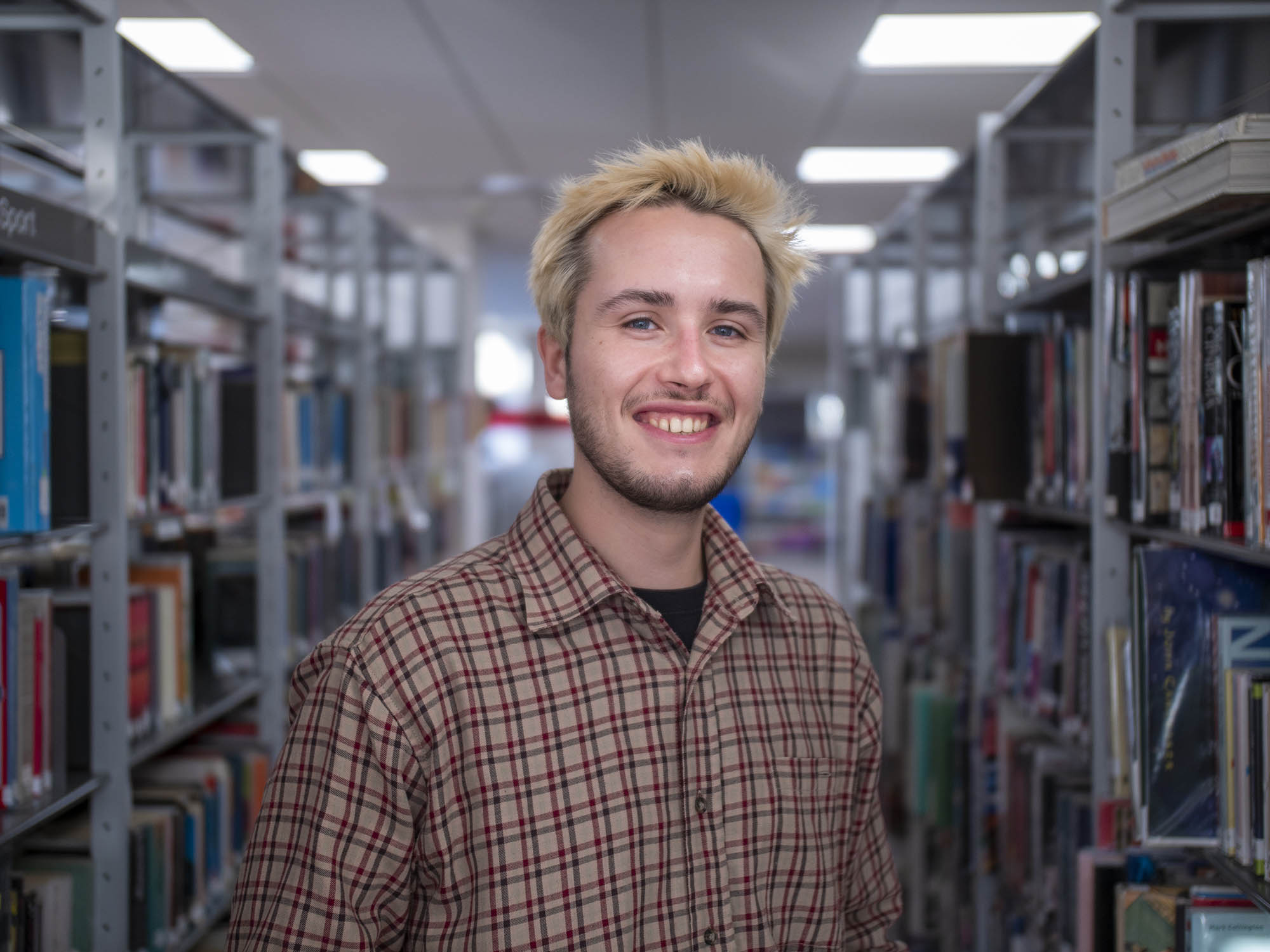 student in library