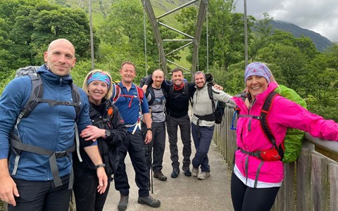 Seven members of the Sports and Fitness Team at Dundee and Angus College crossing a bridge