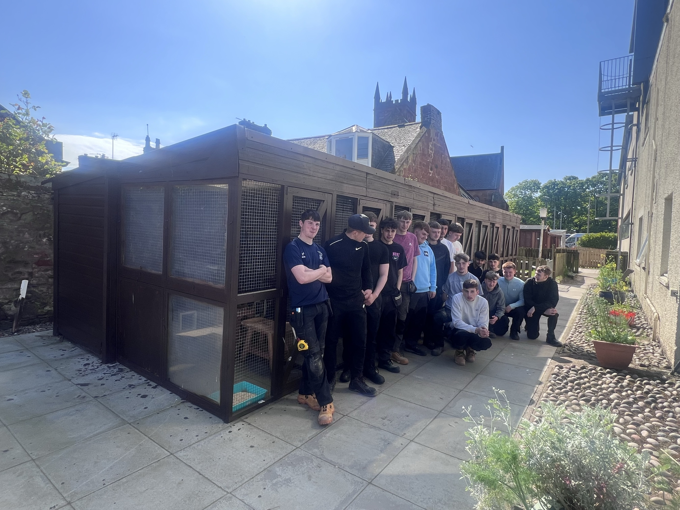 Construction Craft students in front of the animal pens they built at the Arbroath Campus )