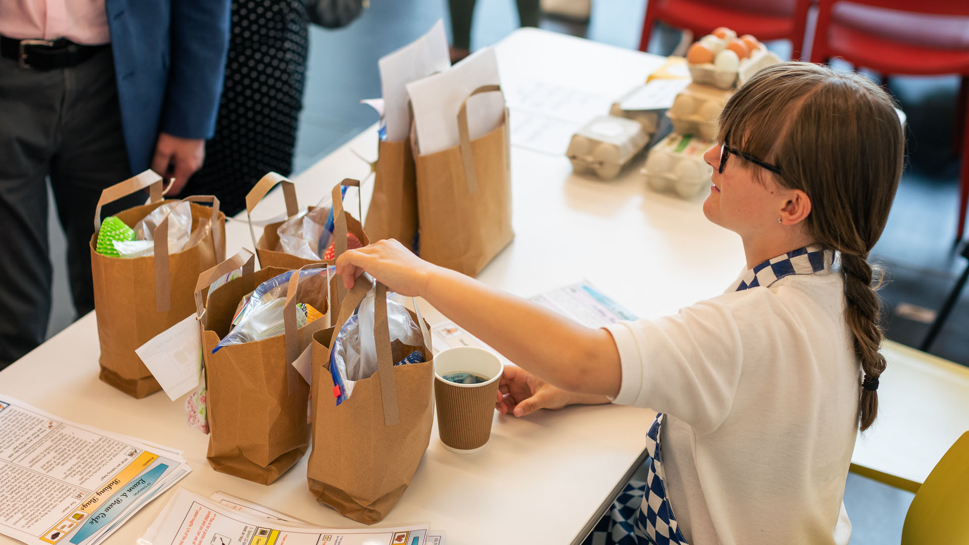 Kingspark pupil selling bake bags and eggs with a smile )