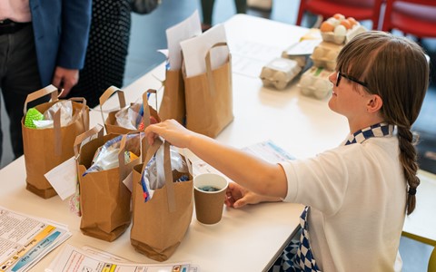 Kingspark pupil selling bake bags and eggs with a smile