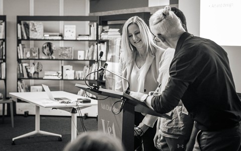 Julie Grace and Paul Dow sign the partnership agreement