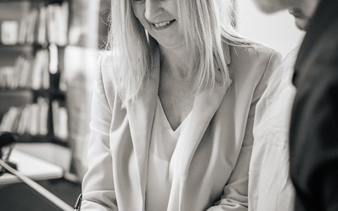 Julie Grace signs the partnership agreement
