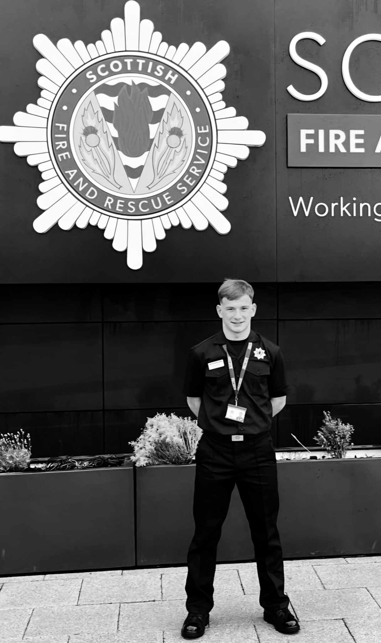 Student Lee Paterson wearing firefighter uniform