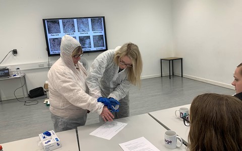Students learning about fingerprinting and forensic science