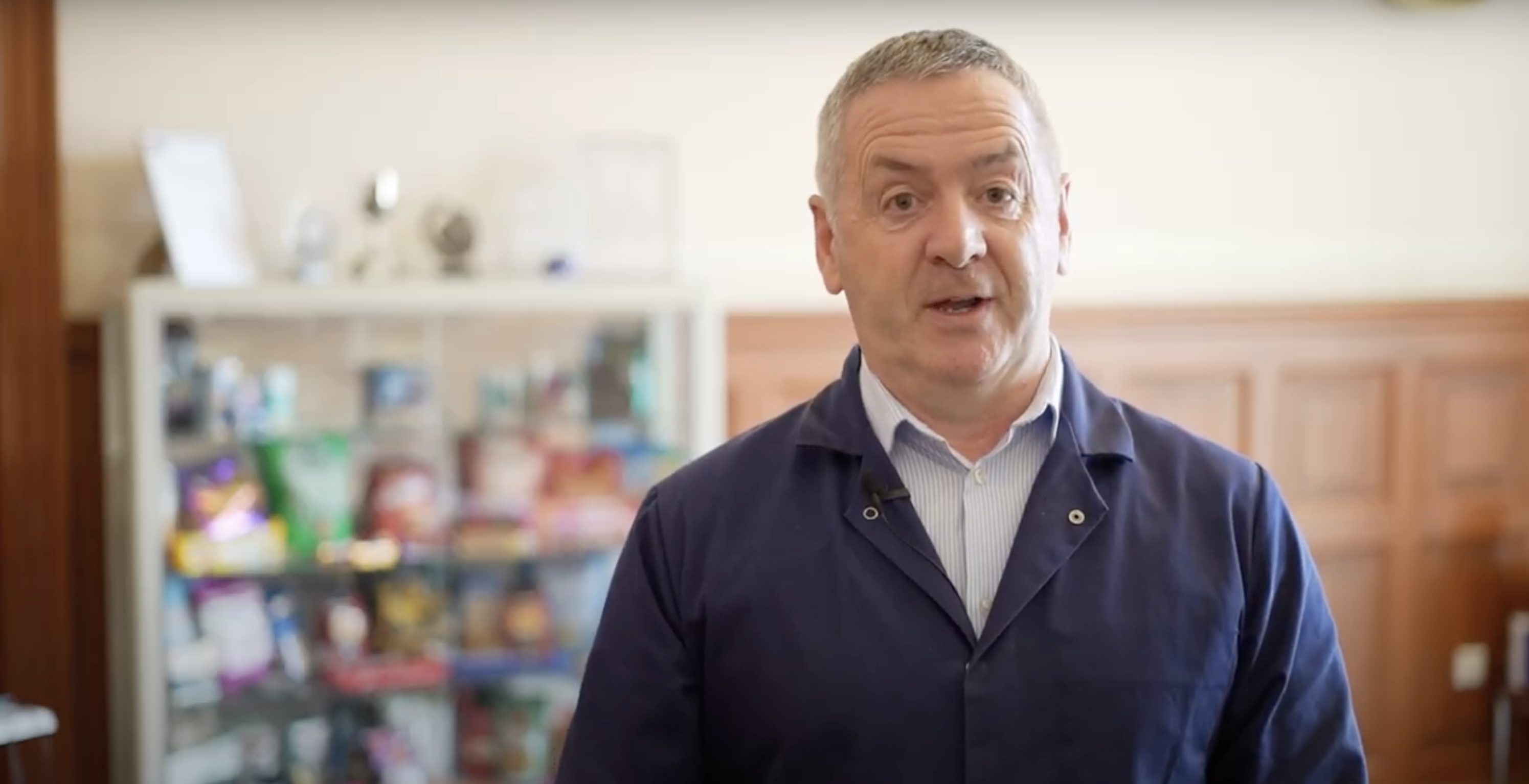 owner of discovery flexibles in boiler suit smiling 