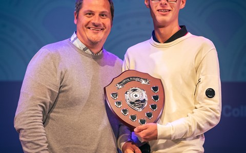 Student receiving the Leon Gibson Memorial Award from Lecturer Ronnie Hamilton