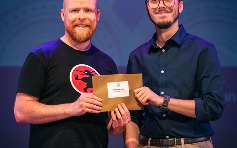 Student receiving prize from Ninja Kiwi