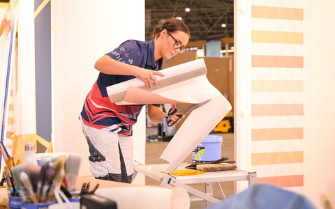 Dior cutting wallpaper at the WorldSkills competition