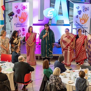 Photograph of the Mobile Teaching Kitchen giving a talk at the College of Sanctuary event at Gardyne Campus