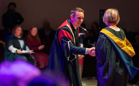 2024 graduation - Principal shaking hands with student