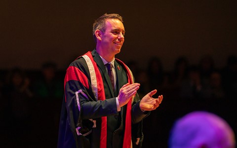 2024 graduation - principal clapping hands