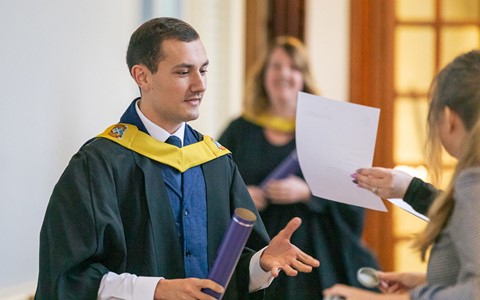 2024 graduation - student receiving certificate
