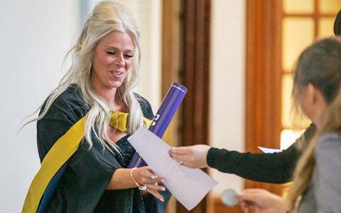 2024 graduation - student receiving certificate