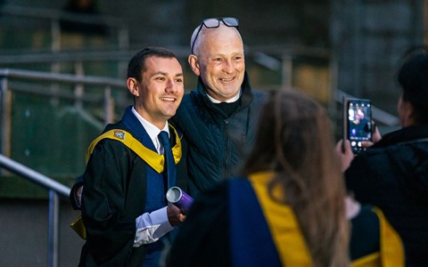 2024 graduation - graduates and guests outside Caird Hall