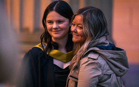 2024 graduation - graduates and guests outside Caird Hall