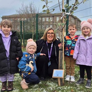nursery children with a tree