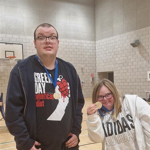 Jenna and Cameron with their Gold Medals