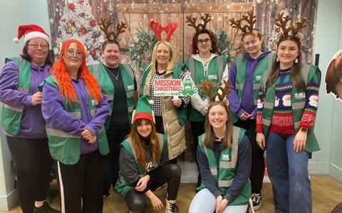 Staff and students volunteering at Mission Christmas
