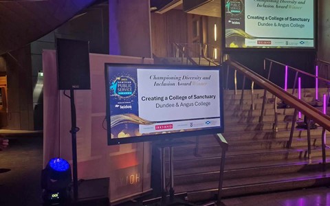 Screen announcing Dundee & Angus College as the winners of the Championing Diversity & Inclusion Award at this year's Scottish Public Services Award