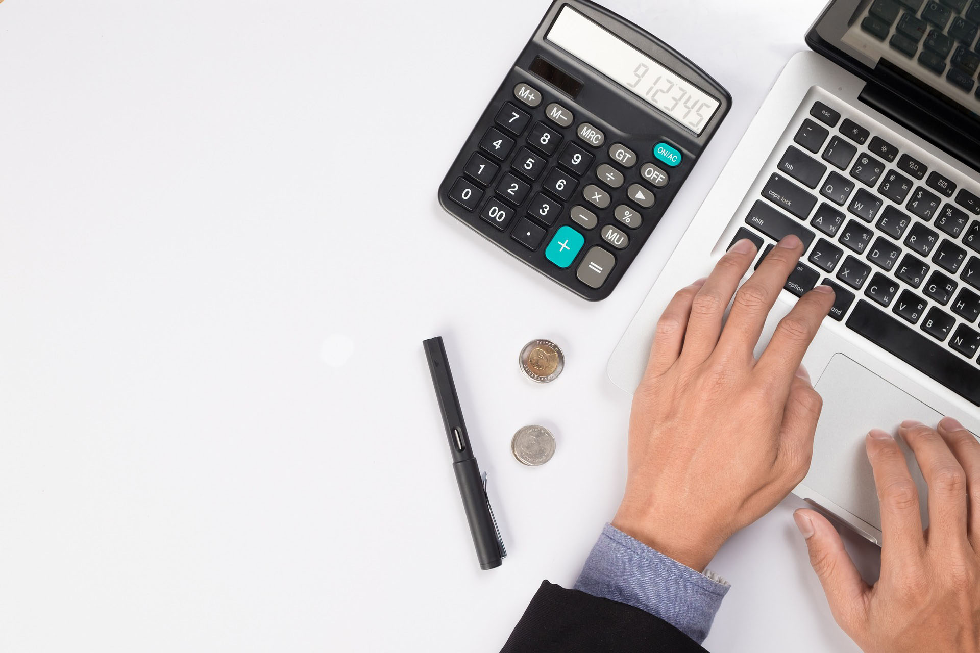 hands with laptop, calculator and coins