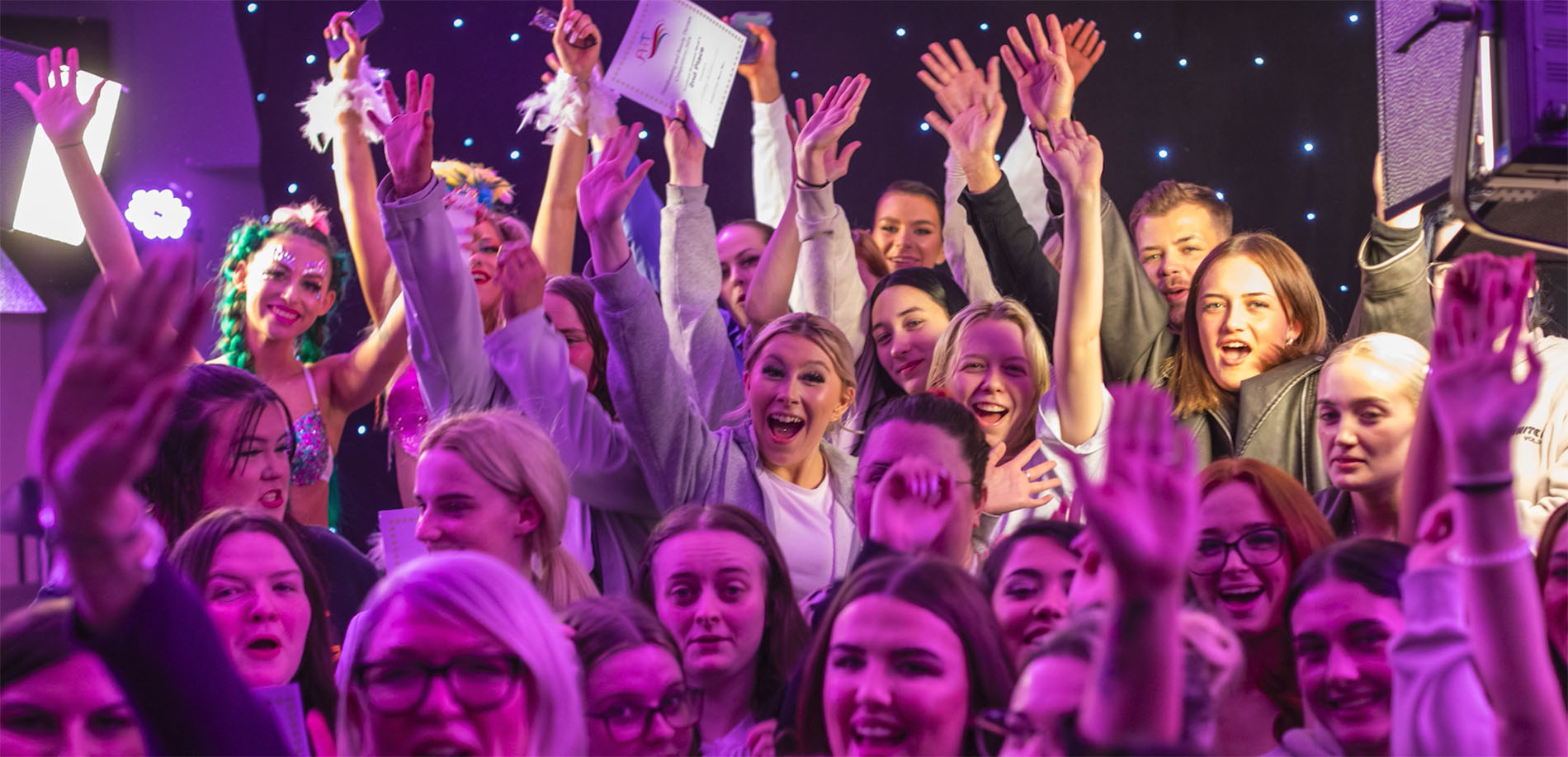 crowd cheering and celebrating a competition win