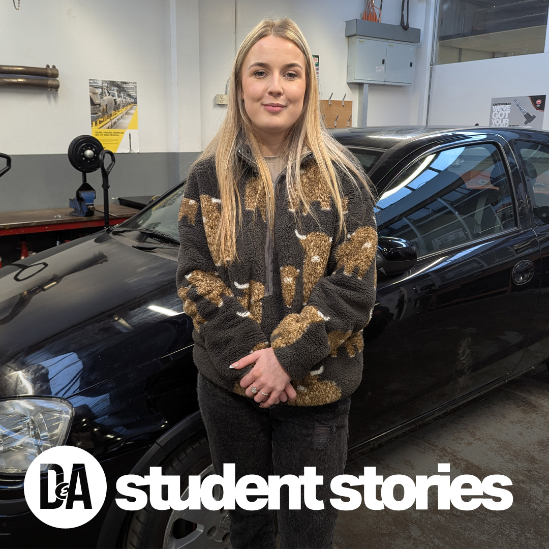 Student Noelle standing in front of car in garage