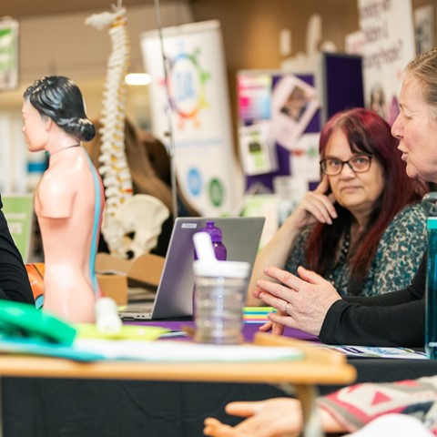 Health and Social care staff chatting to visitor