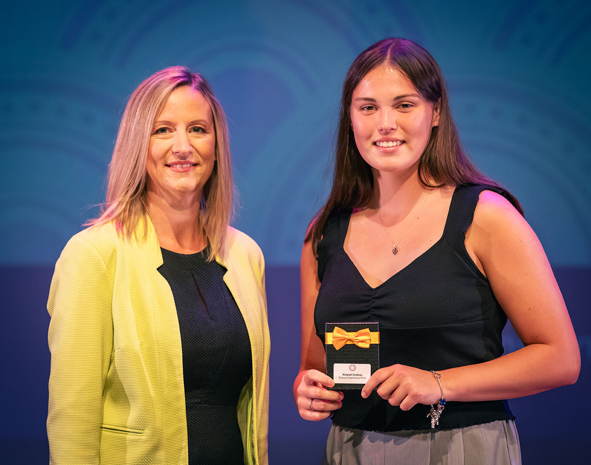 prize winner receiving their prize on stage