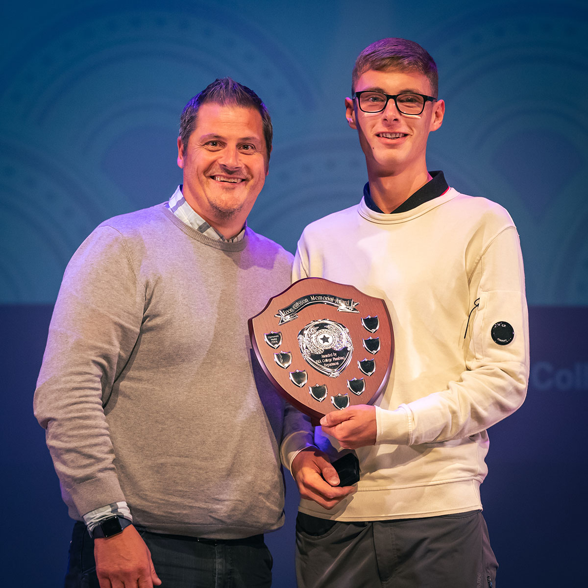 prize winner receiving their prize on stage