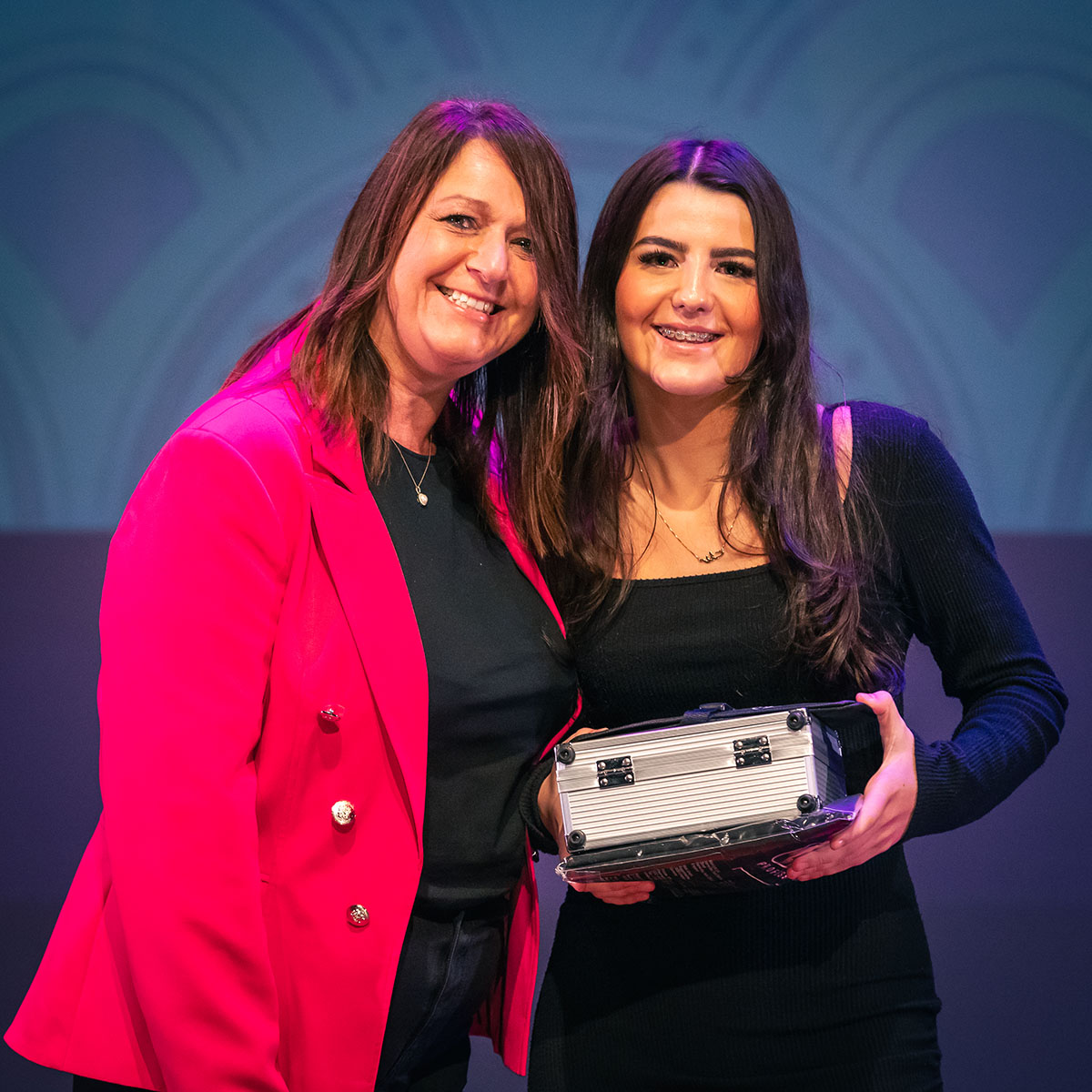 prize winner receiving their prize on stage