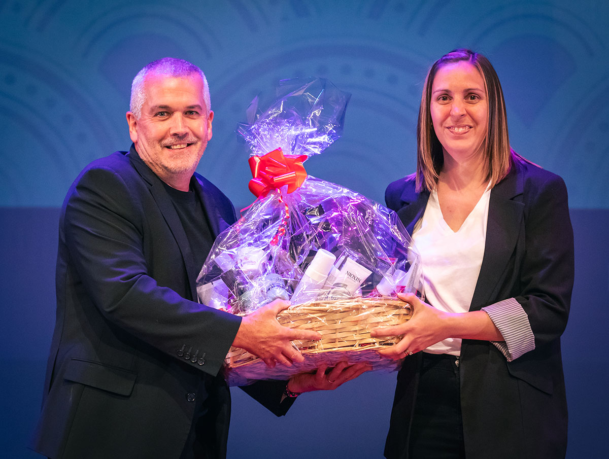 prize winner receiving their prize on stage