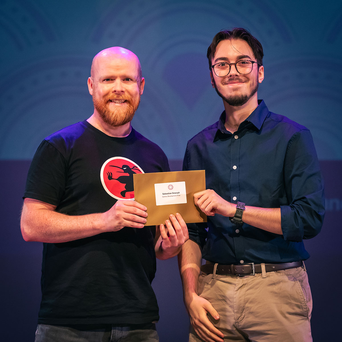 prize winner receiving their prize on stage