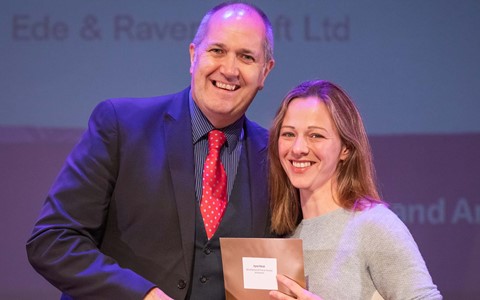 Student receiving prize from sponsor