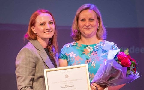 Student receiving prize from sponsor