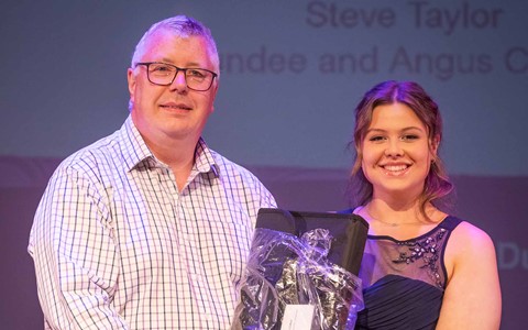 Student receiving prize from Vice Principal