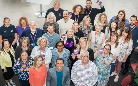 Principal and VPs of D&A College stand with a group of award winning staff at the colleges 2025 Staff Award Ceremony