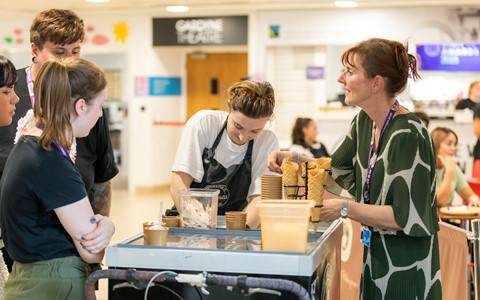 Ice cream is served to a group of staff members at the staff awards