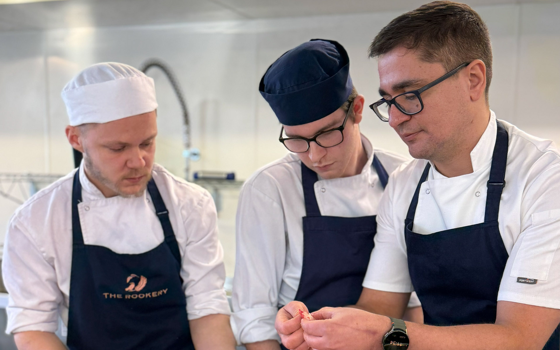 Guest chef showing students seafood