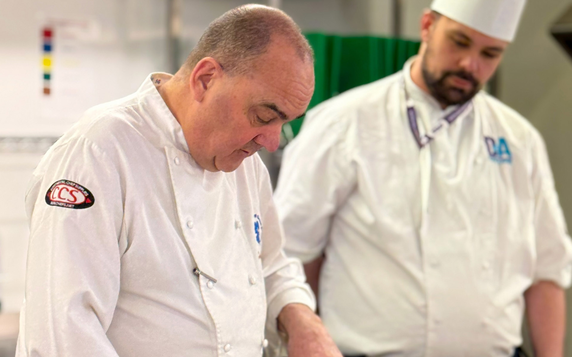 Guest chef doing demonstration in college kitchen