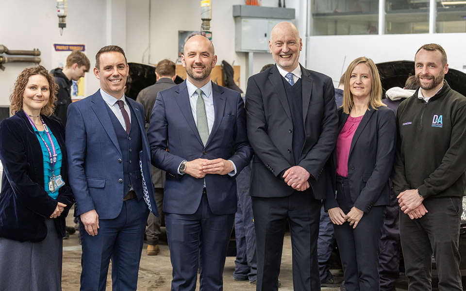 College staff & Ben Macpherson in workshop