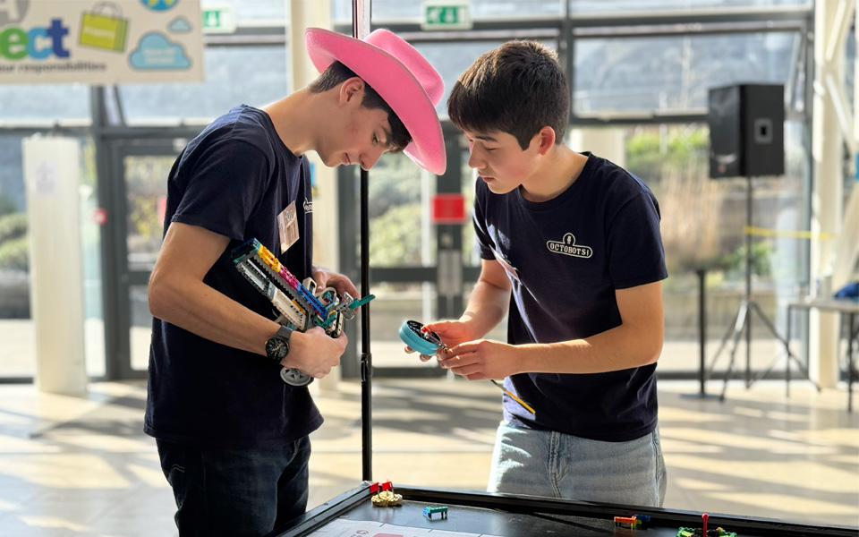 School pupils fixing lego robot